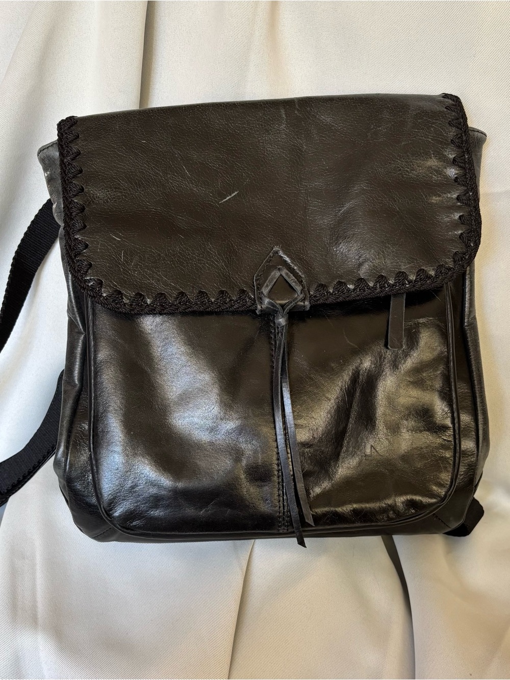 The SAK Black Leather Messenger Bag - Classic Everyday crossbody and backpack.
